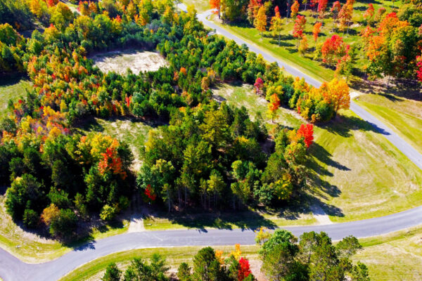 Aerial photo of several parcels at the intersection of the newly paved blacktop road in Paradise Ranch.