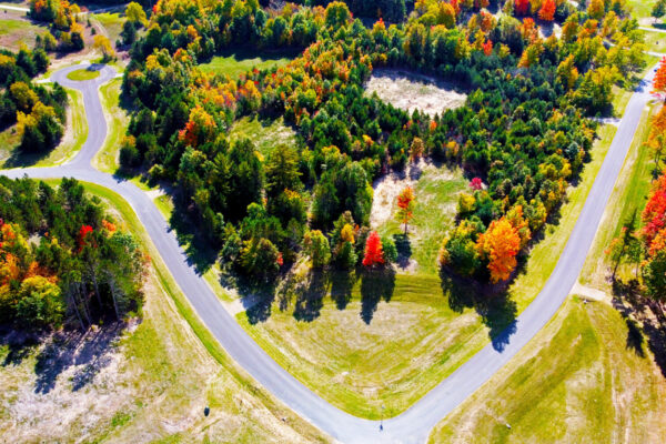 Aerial photo of several parcels at the intersection of the newly paved blacktop road in Paradise Ranch.